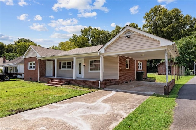 ranch-style house featuring a front yard, a carport, and a porch