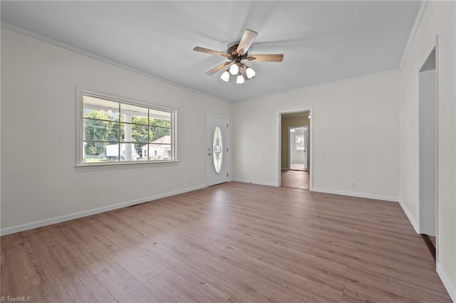 unfurnished room featuring ceiling fan, hardwood / wood-style flooring, and crown molding