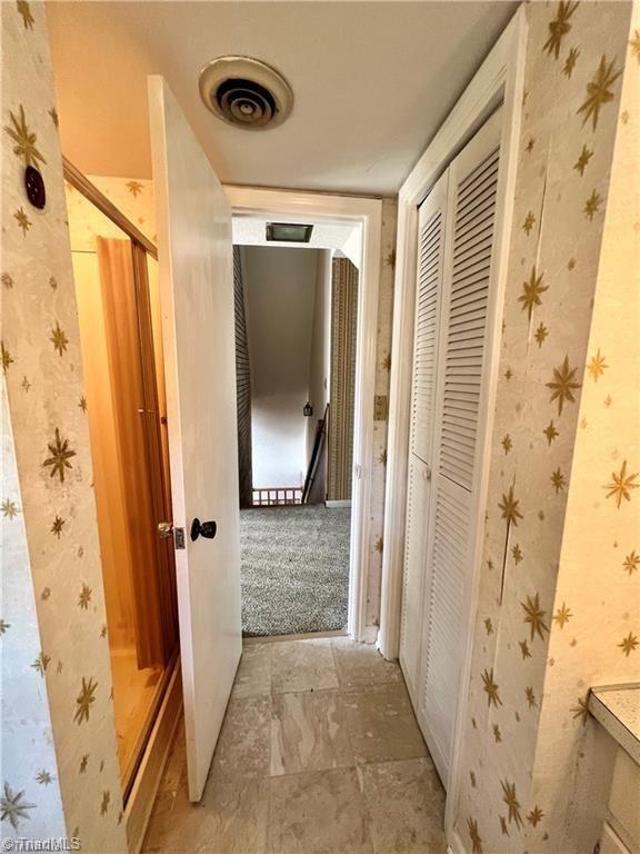 hallway featuring tile patterned floors