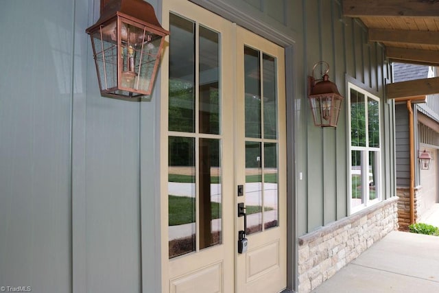 entrance to property with board and batten siding and french doors