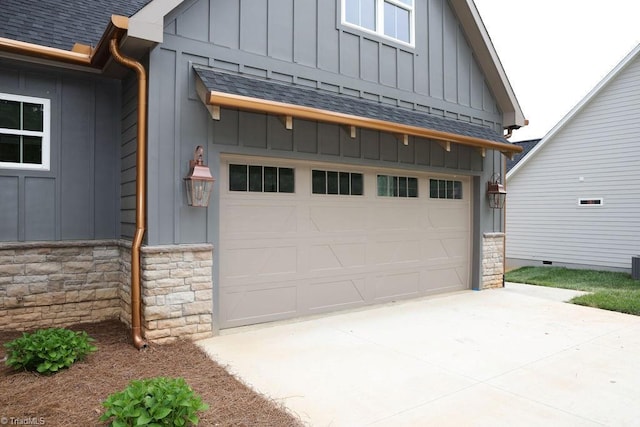 garage featuring concrete driveway