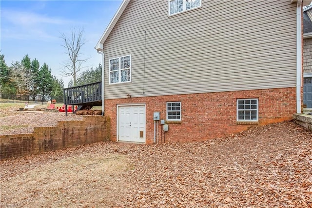 view of side of property featuring a deck