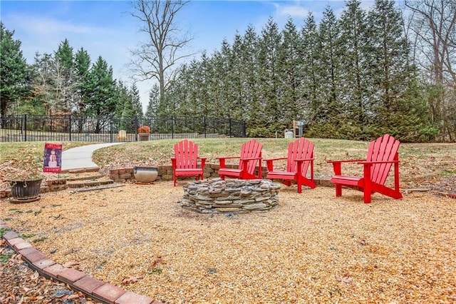 view of yard with a fire pit