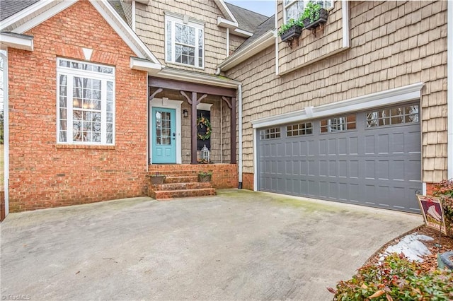 view of exterior entry with a garage