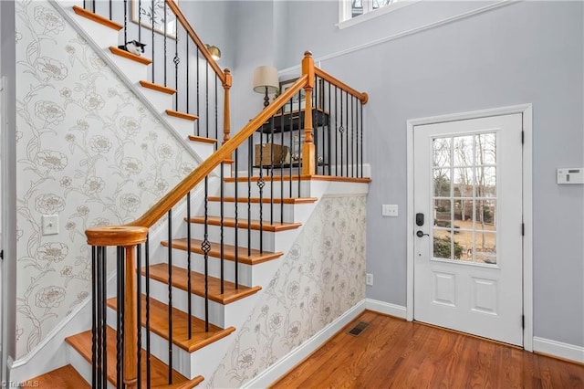 entryway with hardwood / wood-style floors