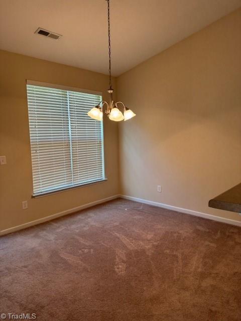 4373 Rex Ct, Winston-Salem, NC 27107 - empty room featuring a chandelier, baseboards, and carpet floors
