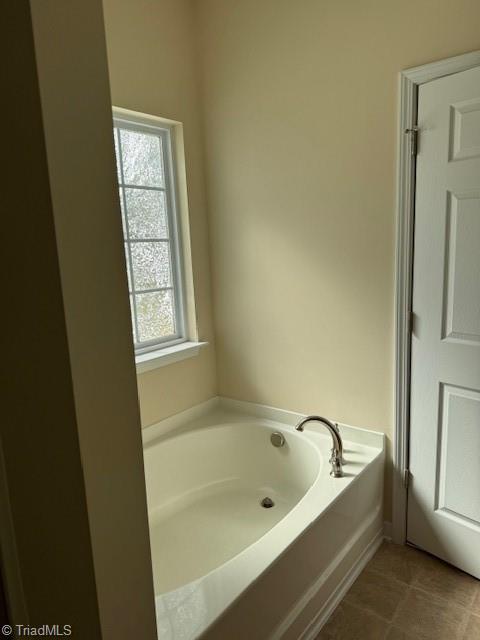 4373 Rex Ct, Winston-Salem, NC 27107 - bathroom featuring a bath and tile patterned flooring