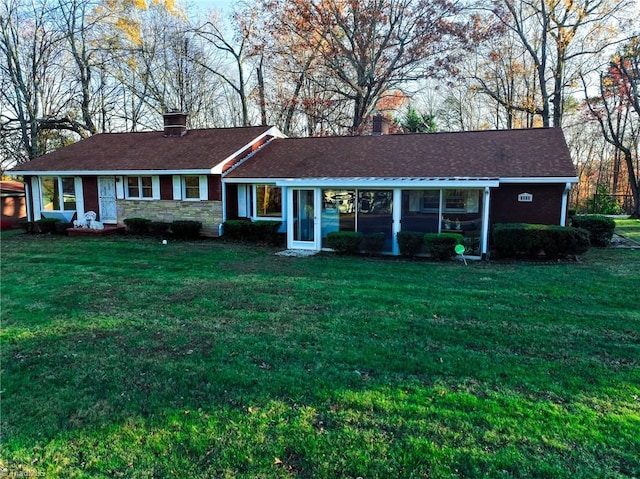 ranch-style house with a front yard