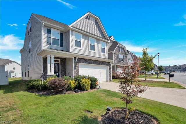 view of front of property with a front yard and a garage