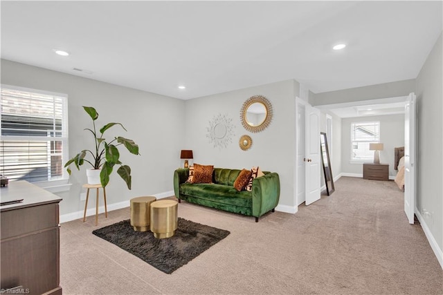 living room featuring light colored carpet