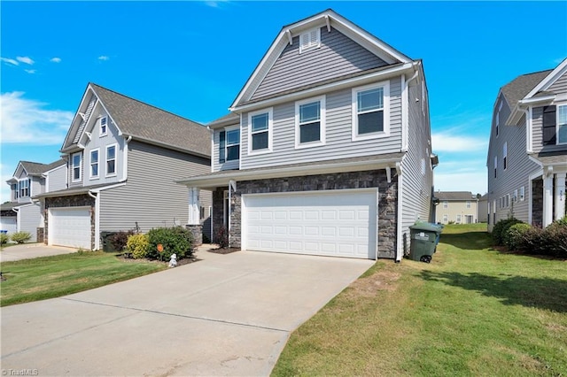 view of front of home featuring a garage and a front yard