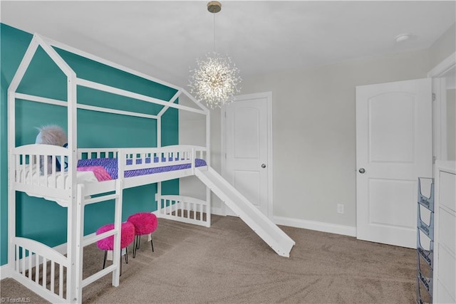 bedroom featuring carpet floors and an inviting chandelier