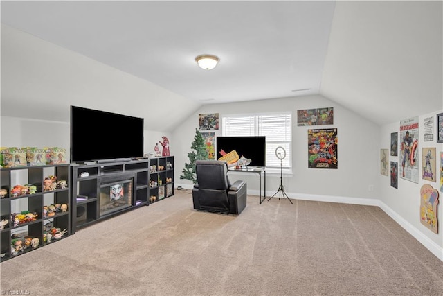 interior space with vaulted ceiling and carpet flooring