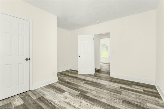 127 Oak Summit Rd, Winston-Salem, NC 27105 - empty room with wood finished floors and a textured ceiling