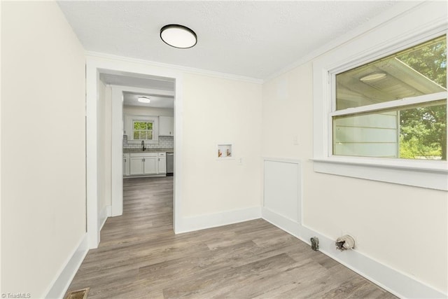 127 Oak Summit Rd, Winston-Salem, NC 27105 - laundry area with washer hookup, light wood-style floors, healthy amount of natural light, crown molding, and gas dryer hookup