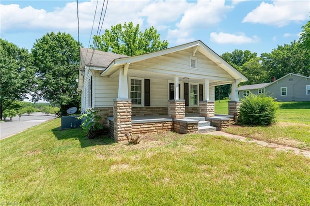 127 Oak Summit Rd, Winston-Salem, NC 27105 - view of front of property featuring covered porch, a front yard, and stone siding