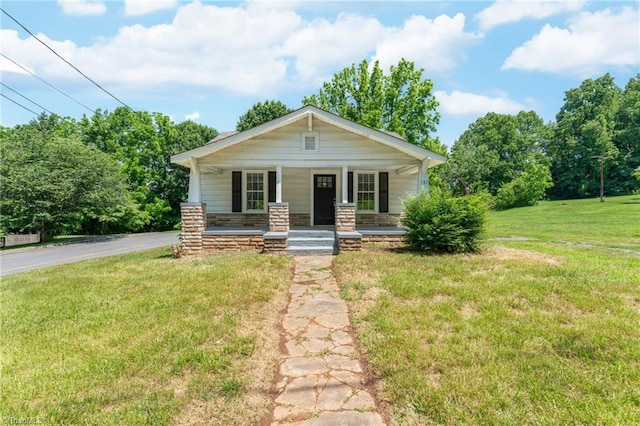 127 Oak Summit Rd, Winston-Salem, NC 27105 - view of front facade featuring a porch and a front lawn