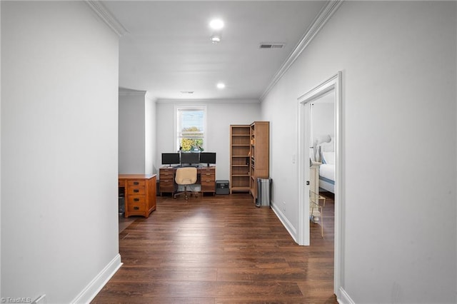 hall with dark hardwood / wood-style floors and crown molding