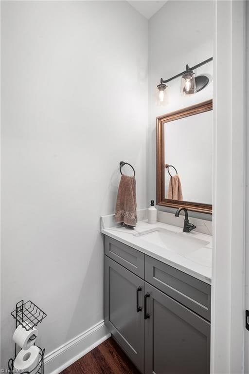 bathroom with vanity and hardwood / wood-style flooring