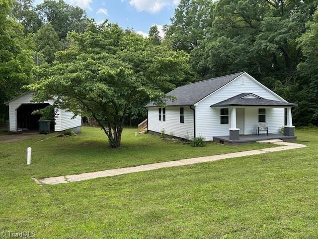 545 S Fieldcrest Rd, Eden, NC 27288 - view of front facade with covered porch and a front lawn