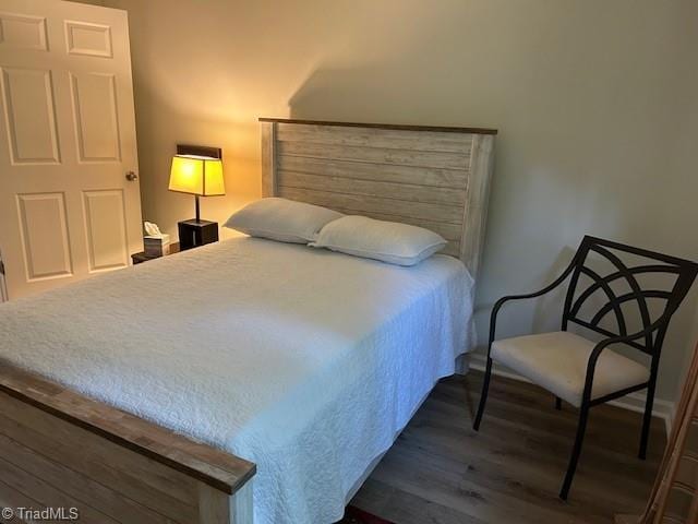545 S Fieldcrest Rd, Eden, NC 27288 - bedroom with dark wood-style floors and baseboards