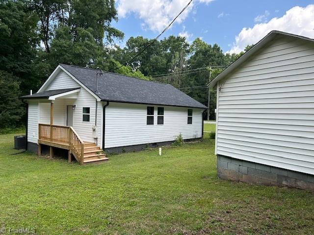 545 S Fieldcrest Rd, Eden, NC 27288 - rear view of house with a lawn and central AC