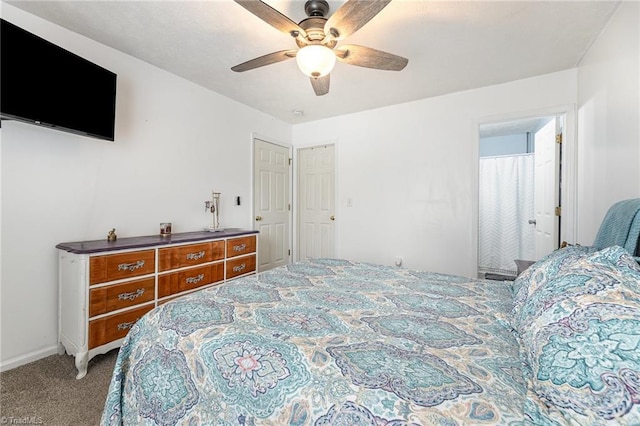 carpeted bedroom with a ceiling fan and baseboards