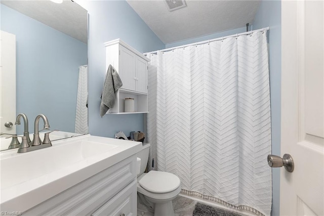 full bathroom featuring visible vents, toilet, a textured ceiling, and vanity