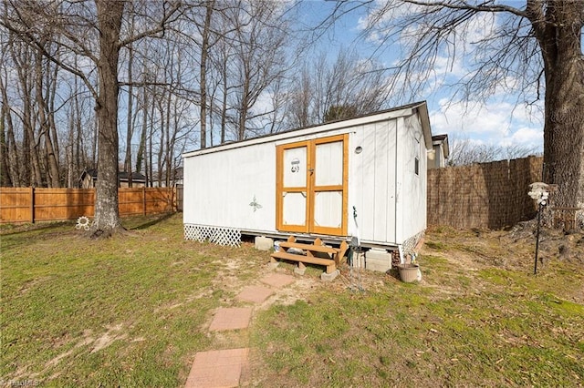 view of shed with a fenced backyard