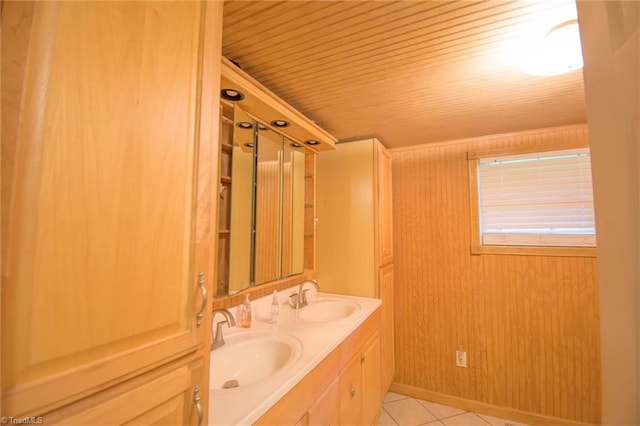 bathroom featuring tile patterned flooring, a sink, double vanity, and wooden ceiling