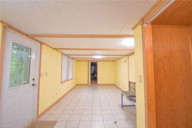 foyer entrance featuring wooden ceiling, baseboards, and light tile patterned flooring