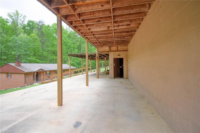 view of patio with a forest view