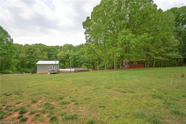 view of yard with a wooded view