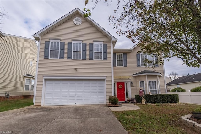 view of front of home featuring a front yard and a garage