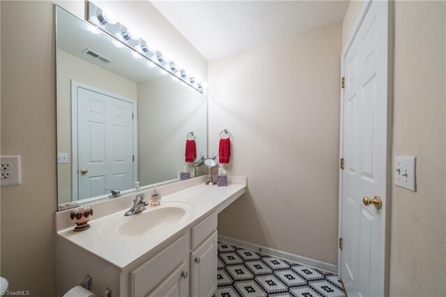 2755 Amesbury Rd, Winston-Salem, NC 27103 - half bathroom featuring vanity and baseboards