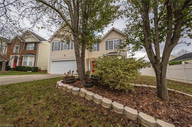 2755 Amesbury Rd, Winston-Salem, NC 27103 - traditional-style house with an attached garage and concrete driveway
