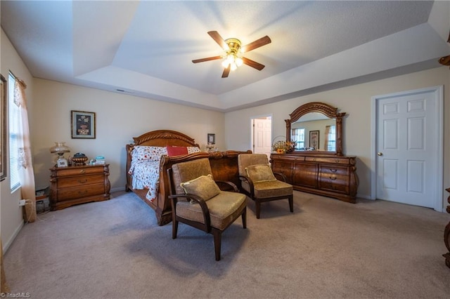 2755 Amesbury Rd, Winston-Salem, NC 27103 - bedroom featuring a raised ceiling, light colored carpet, a ceiling fan, and baseboards