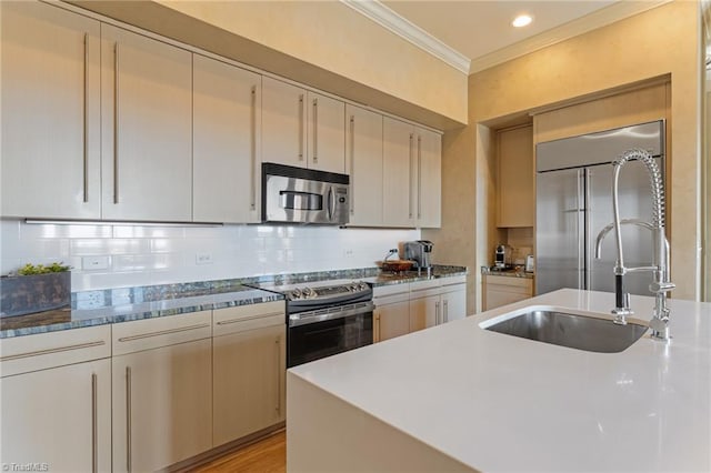 kitchen featuring stainless steel appliances, cream cabinets, ornamental molding, backsplash, and light wood-type flooring