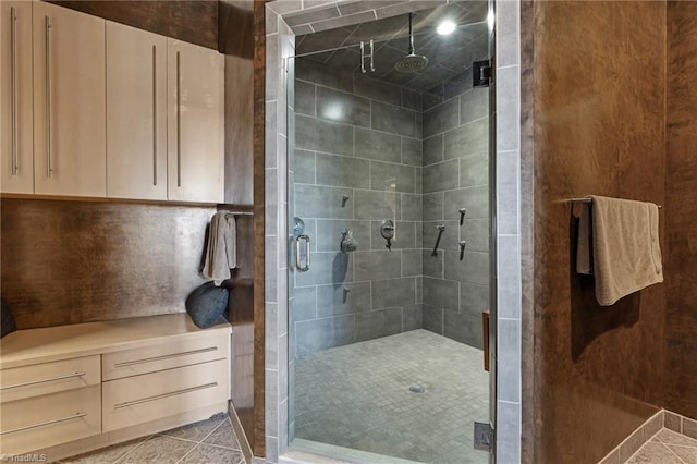 bathroom with walk in shower and tile patterned floors