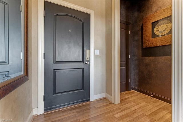 entryway with light hardwood / wood-style flooring