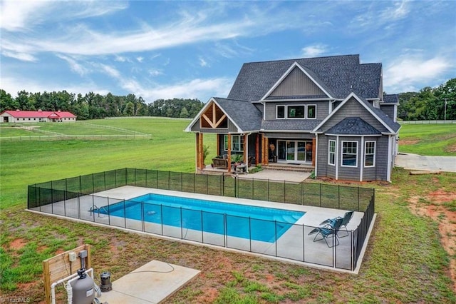 view of swimming pool with a lawn and a patio