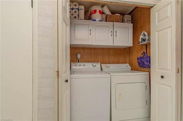 1055 Old Silver Hill Rd, Lexington, NC 27292 - washroom with washer and dryer, cabinet space, and wooden walls