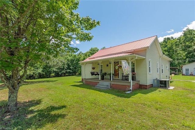 1055 Old Silver Hill Rd, Lexington, NC 27292 - view of front facade with covered porch, a front lawn, metal roof, and cooling unit