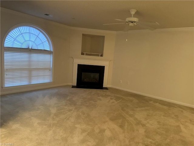 unfurnished living room with light colored carpet, ceiling fan, and ornamental molding