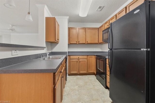 kitchen featuring ornamental molding, a textured ceiling, sink, black appliances, and pendant lighting