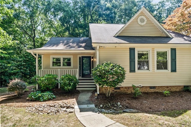 800 Carriage Crossing Ln Unit E, Greensboro, NC 27410 - view of front of property featuring crawl space, a porch, and roof with shingles