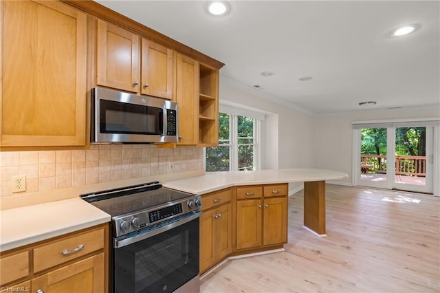 800 Carriage Crossing Ln Unit E, Greensboro, NC 27410 - kitchen featuring appliances with stainless steel finishes, open shelves, light wood-type flooring, light countertops, and tasteful backsplash