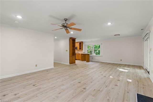 800 Carriage Crossing Ln Unit E, Greensboro, NC 27410 - unfurnished living room with crown molding, a ceiling fan, light wood finished floors, and recessed lighting