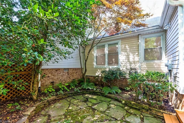 800 Carriage Crossing Ln Unit E, Greensboro, NC 27410 - view of side of home featuring a patio area