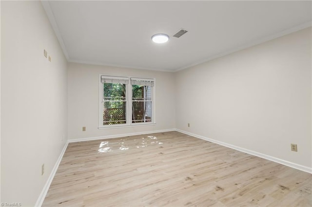 800 Carriage Crossing Ln Unit E, Greensboro, NC 27410 - unfurnished room featuring crown molding and light wood-style flooring